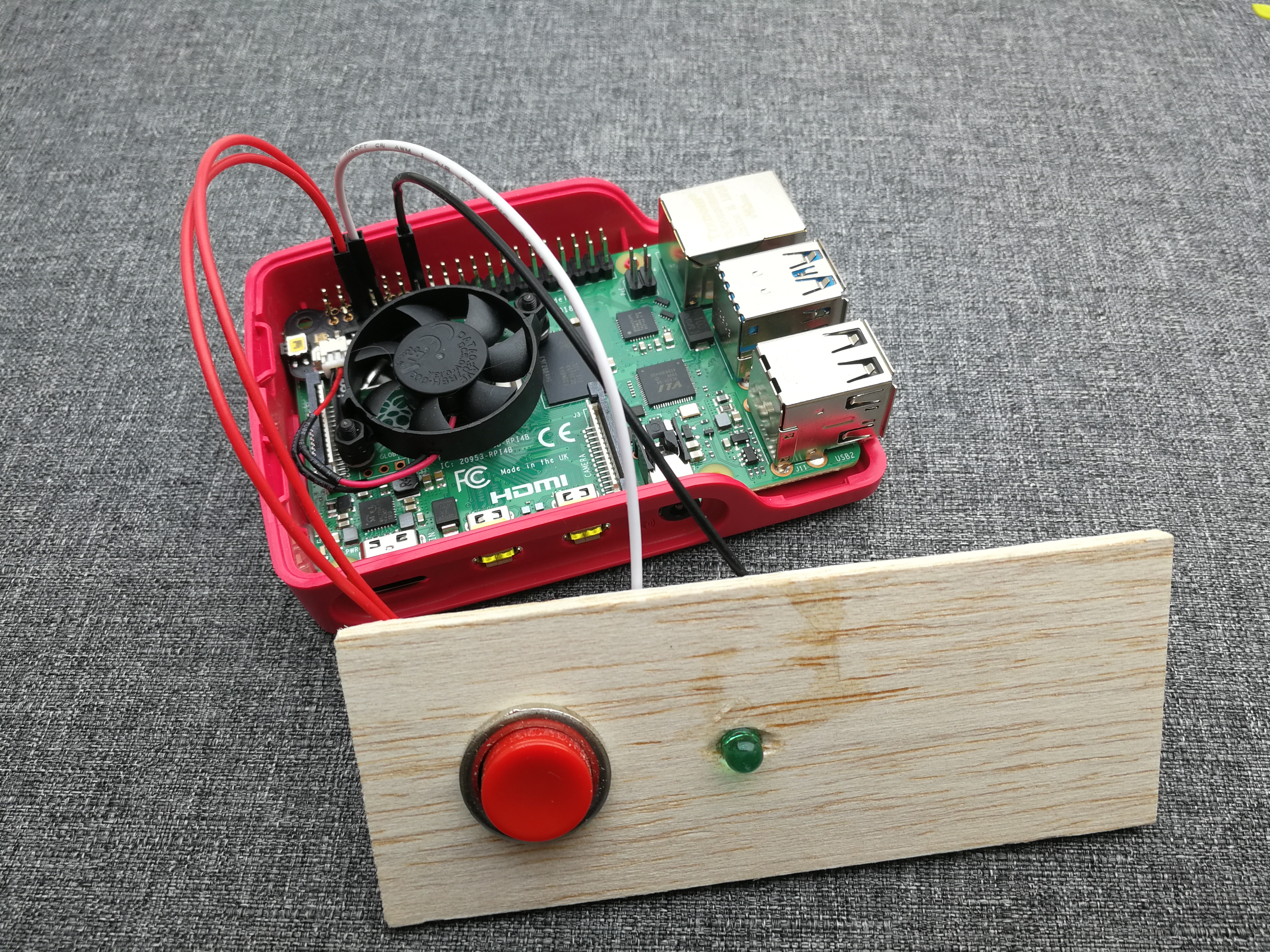 Raspberry Pi 4 with makeshift on/off button and green status LED.